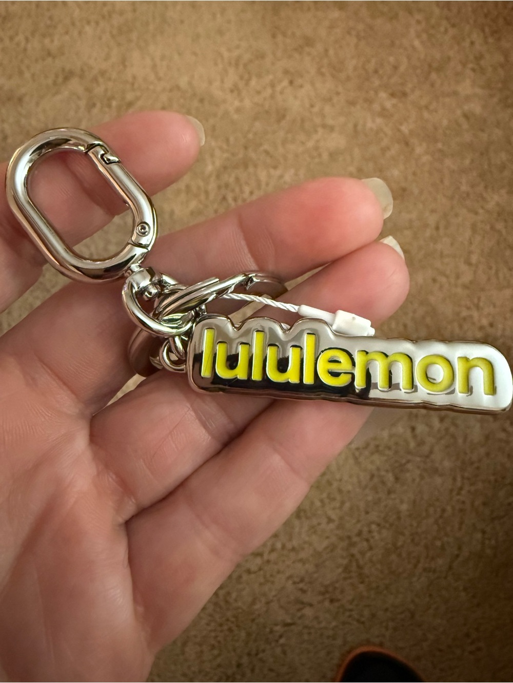 lululemon Silver Keychain with Yellow Logo